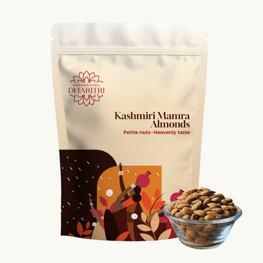 Packaging of Kashmiri Mamra Almonds with a bowl of almonds on a white background