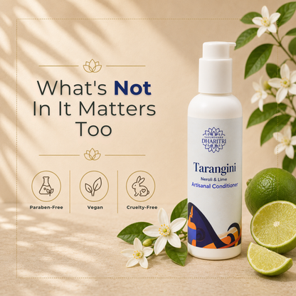 Dharitri Tarangini conditioner bottle with lime and flowers on a beige background