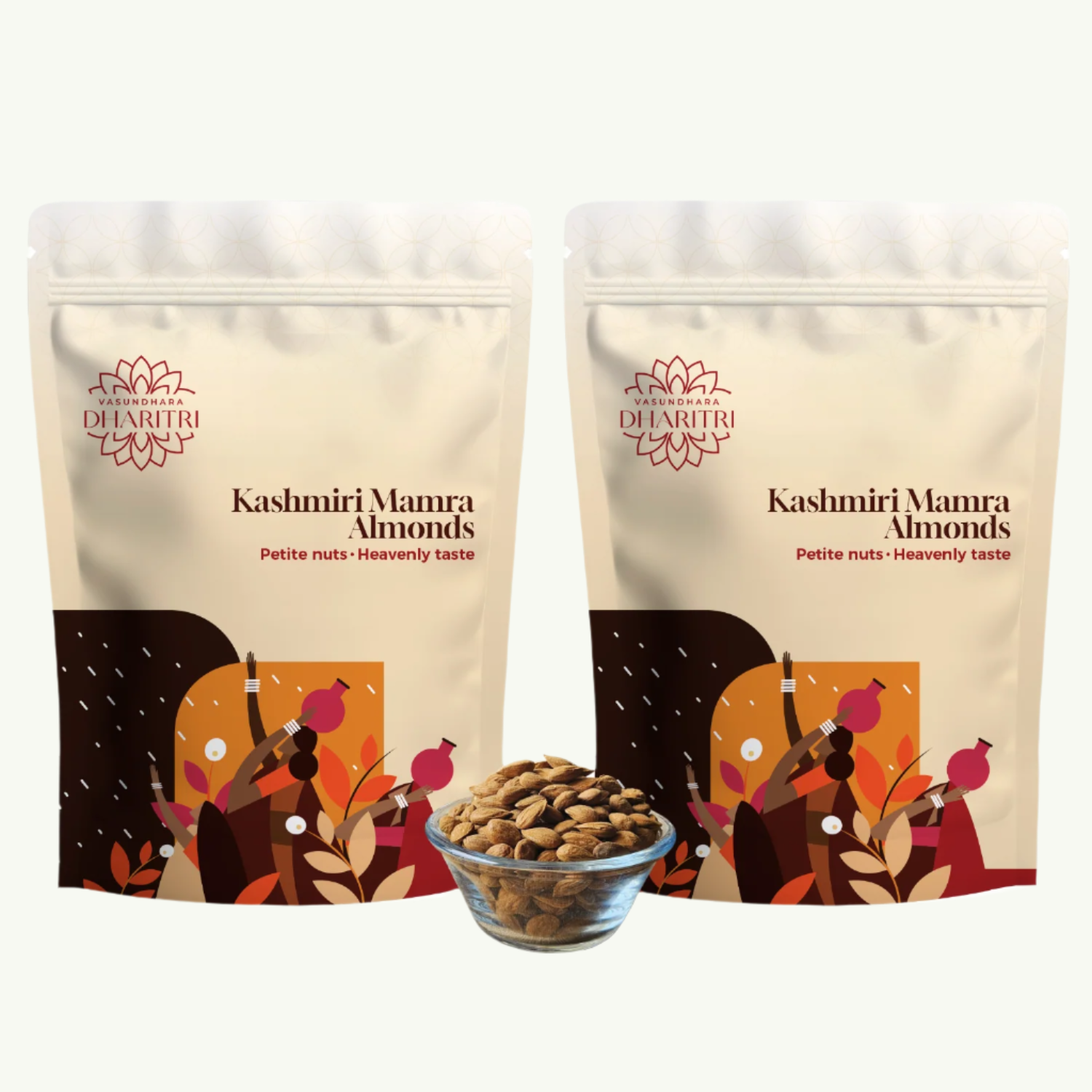 Two packages of Kashmiri Mamra Almonds with a bowl of almonds in front on a white background.